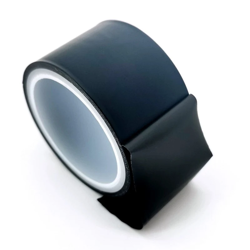 Black film tape unwound from a roll