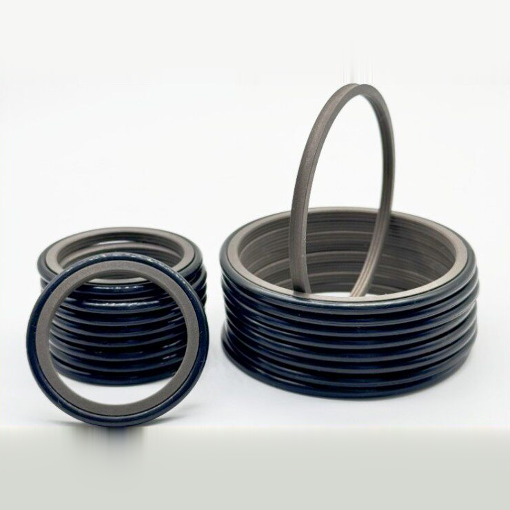 PTFE rotary seal rings stacked with a large sliding ring standing upright