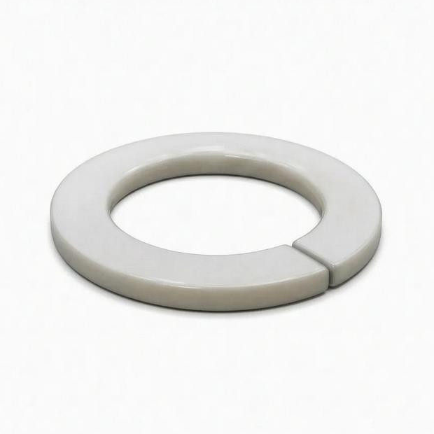 A split flat ring on a pale background showing the side profile